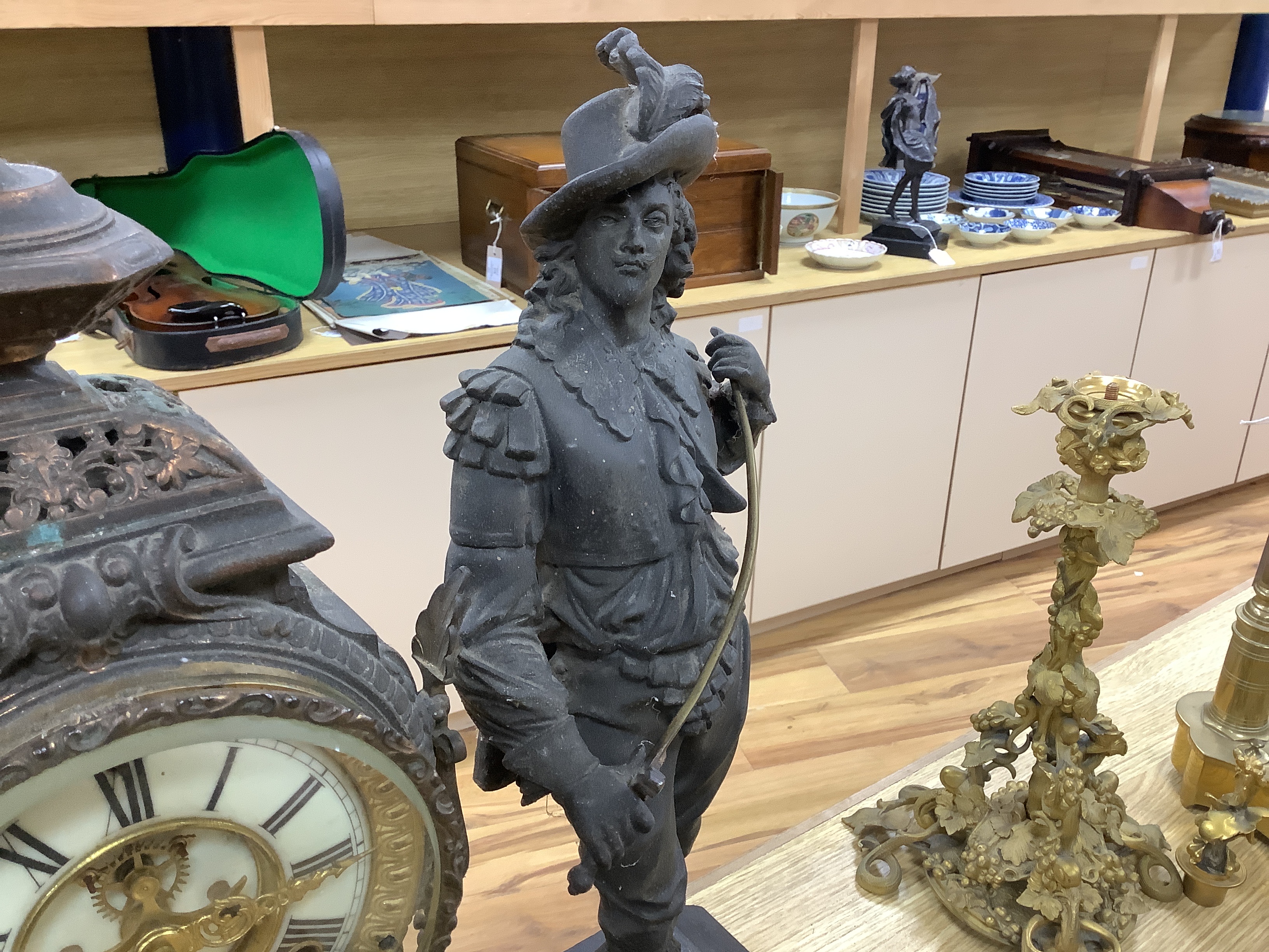 A 20th century American spelter and Cavalier figural mantel clock, 52cm high